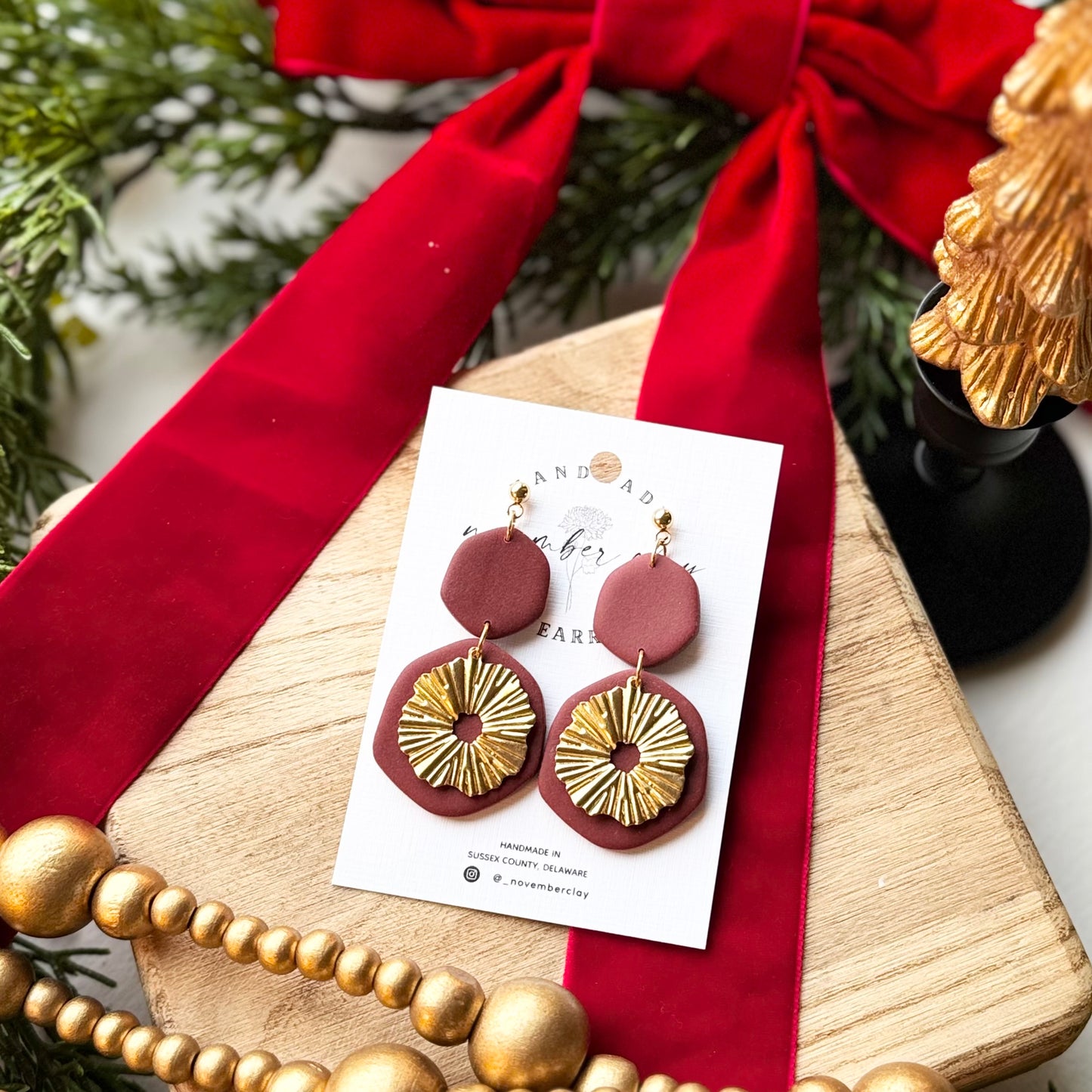 Burgundy 2 Tier Dangle w/Gold Burst Charm